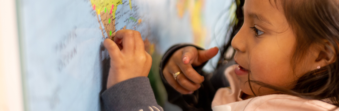 student looking at a world map